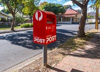 Red PO box on side walk