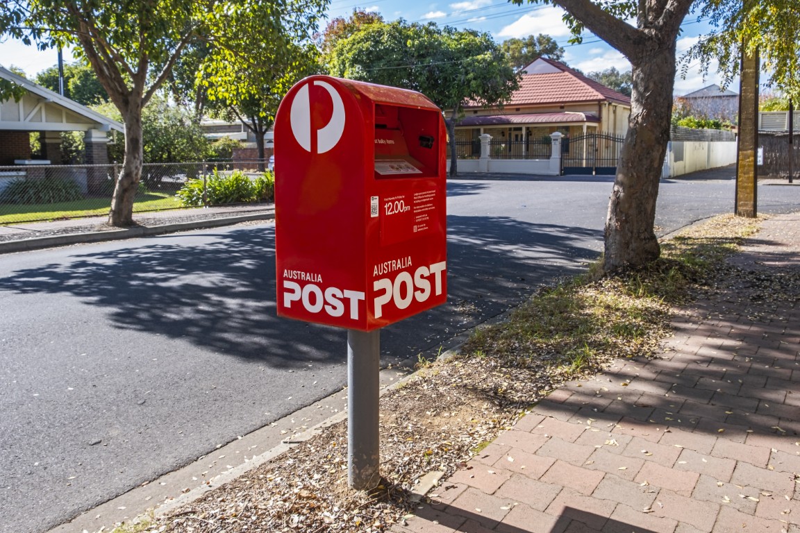 Red PO box on side walk