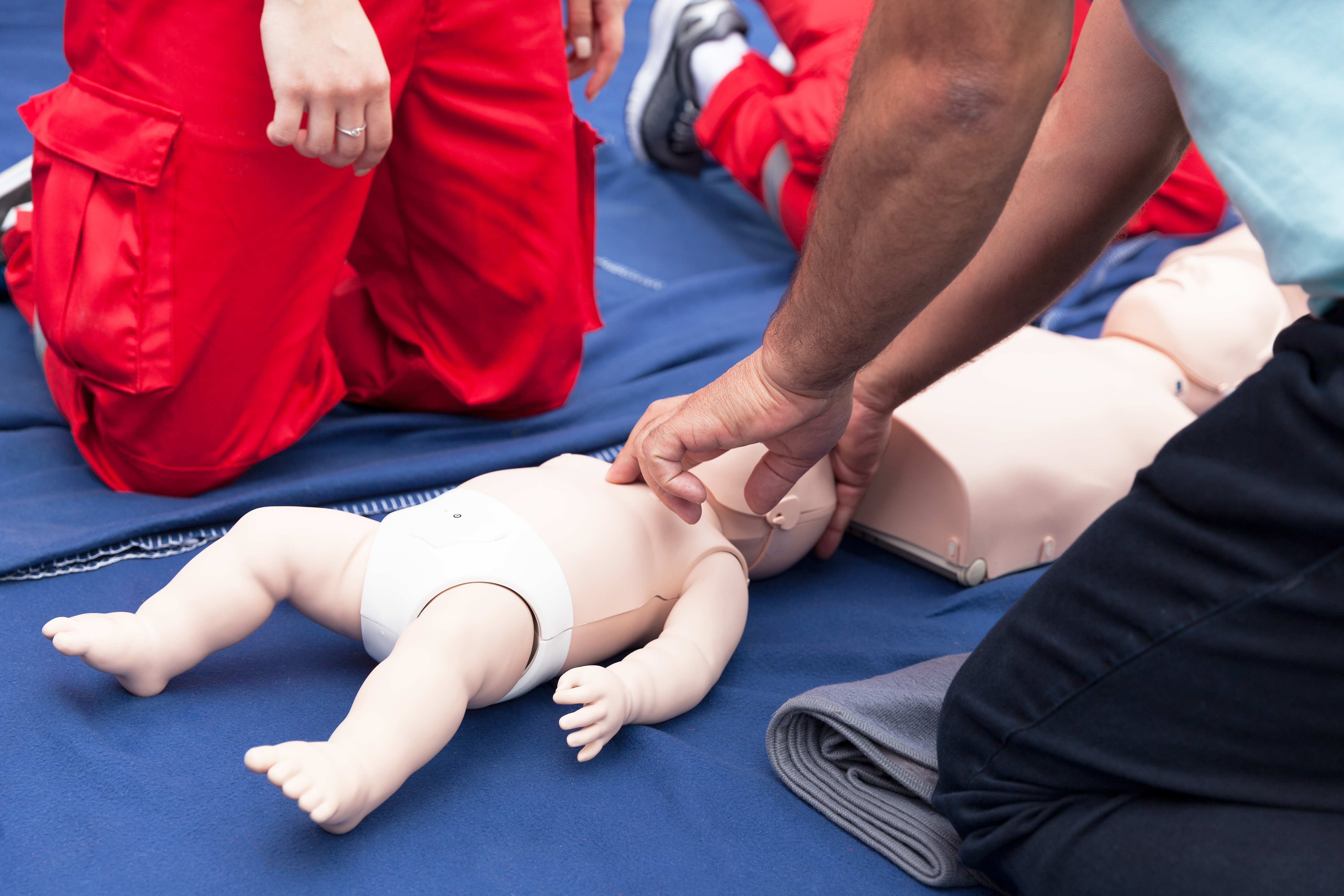 Baby doll getting first aid