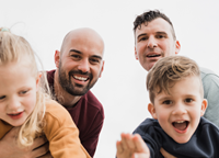 Two dads with a daughter and son