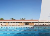 Carnegie Memorial Swimming Pool artist rendering shaded swim lanes with a splash pad and barbeque area in the background