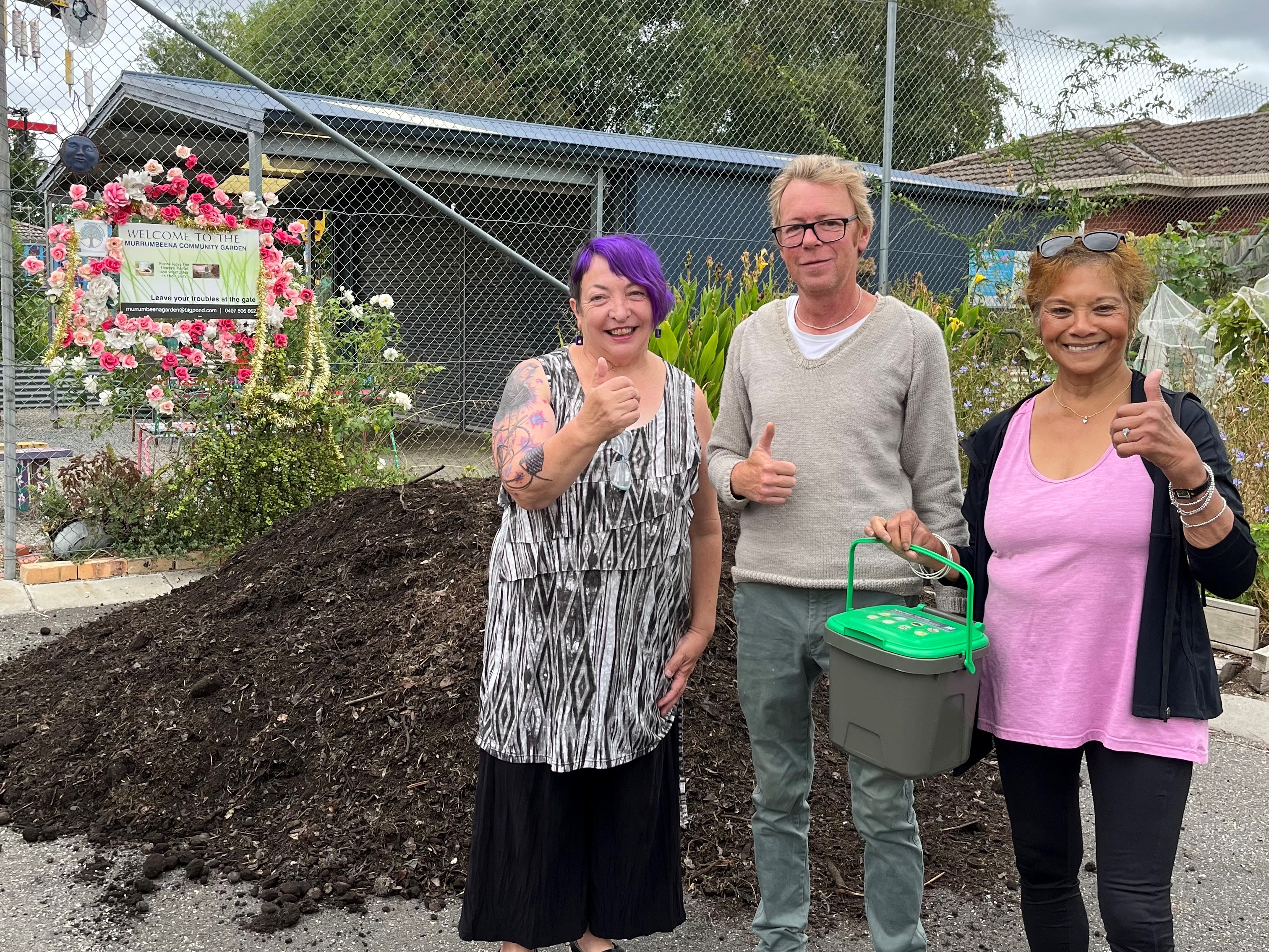 Food recycled in Glen Eira green bins gets turned into compost. Photo: Members of Murrumbeena Community Garden with a compost delivery.