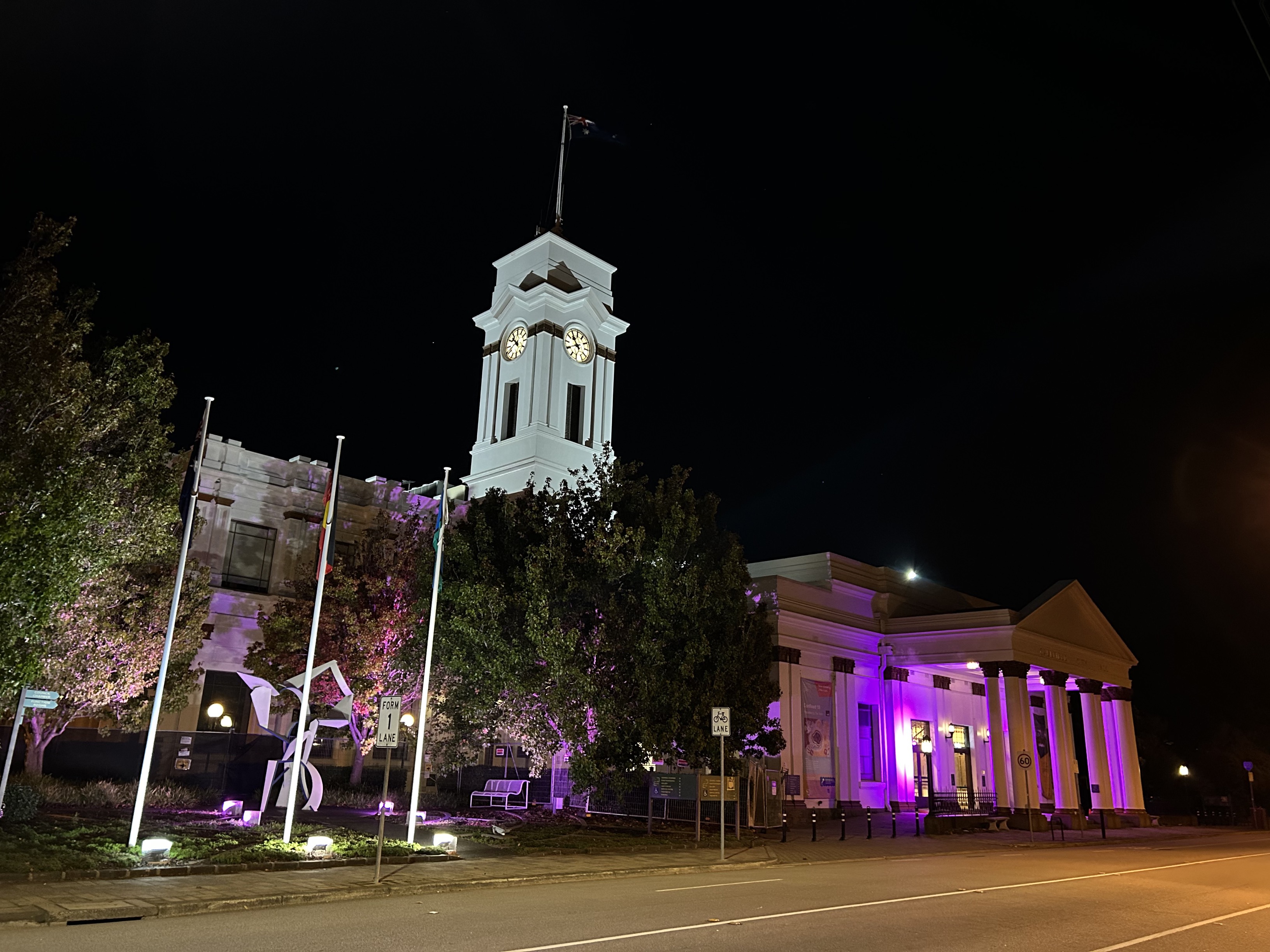Image of the Town Hall light up in purple