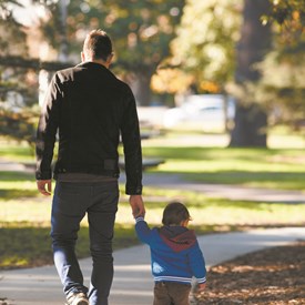 Father and son walking in the park