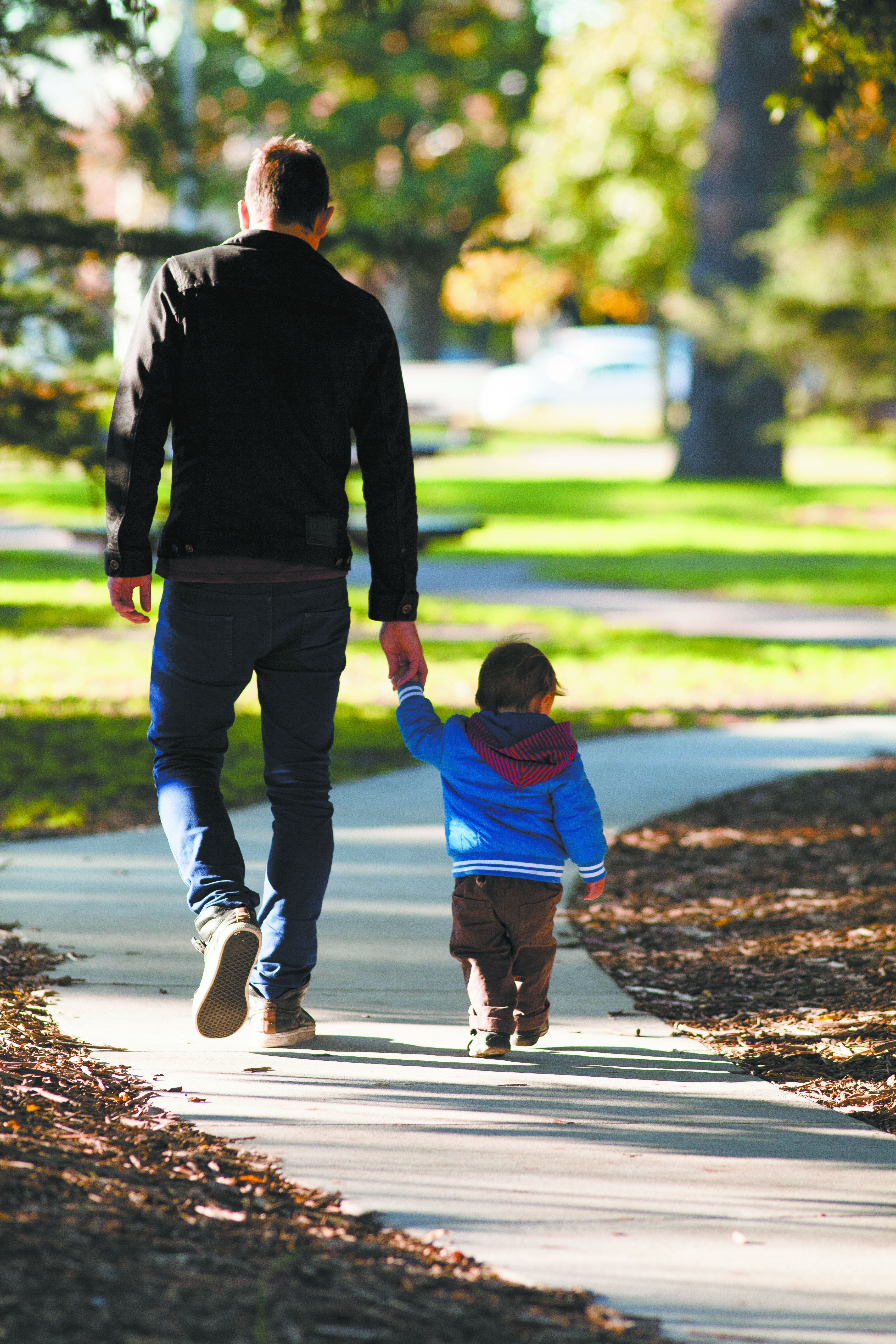 Father and son walking in the park