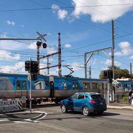 Train and car at the level crossing, Glenhuntly Road