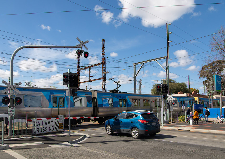 Train and car at the level crossing, Glenhuntly Road
