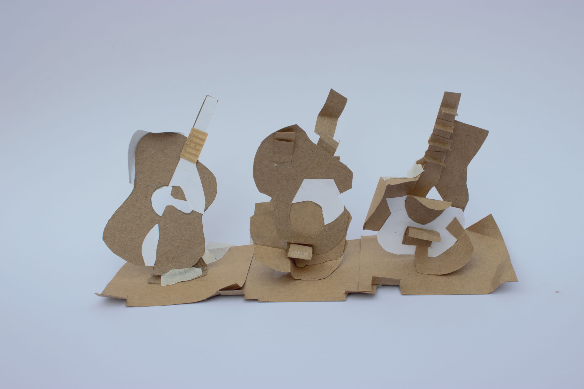 Mixed media artwork of three guitars