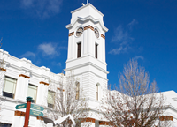 Town Hall clock and flag on building