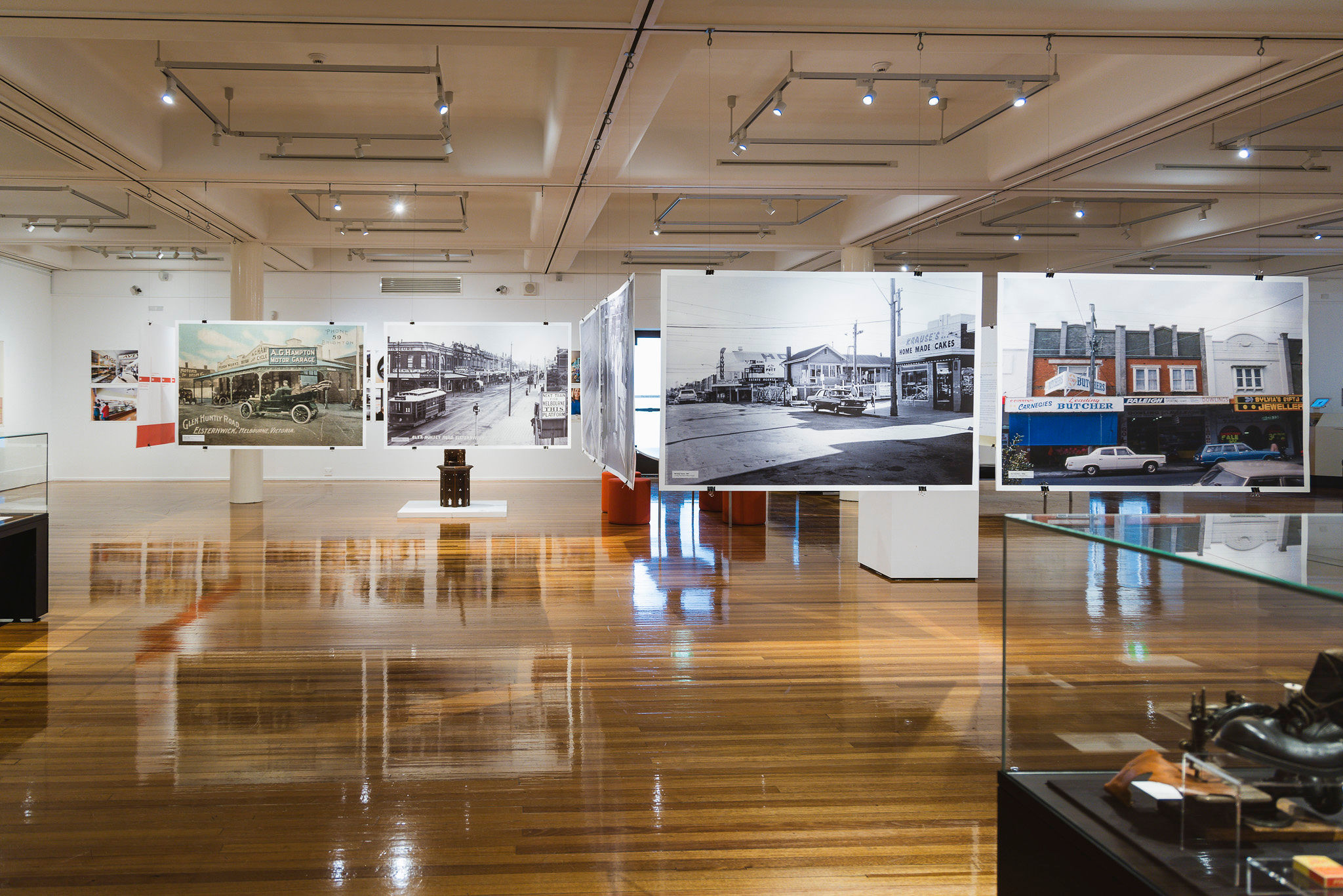 Large hanging photos of local shops throughout history