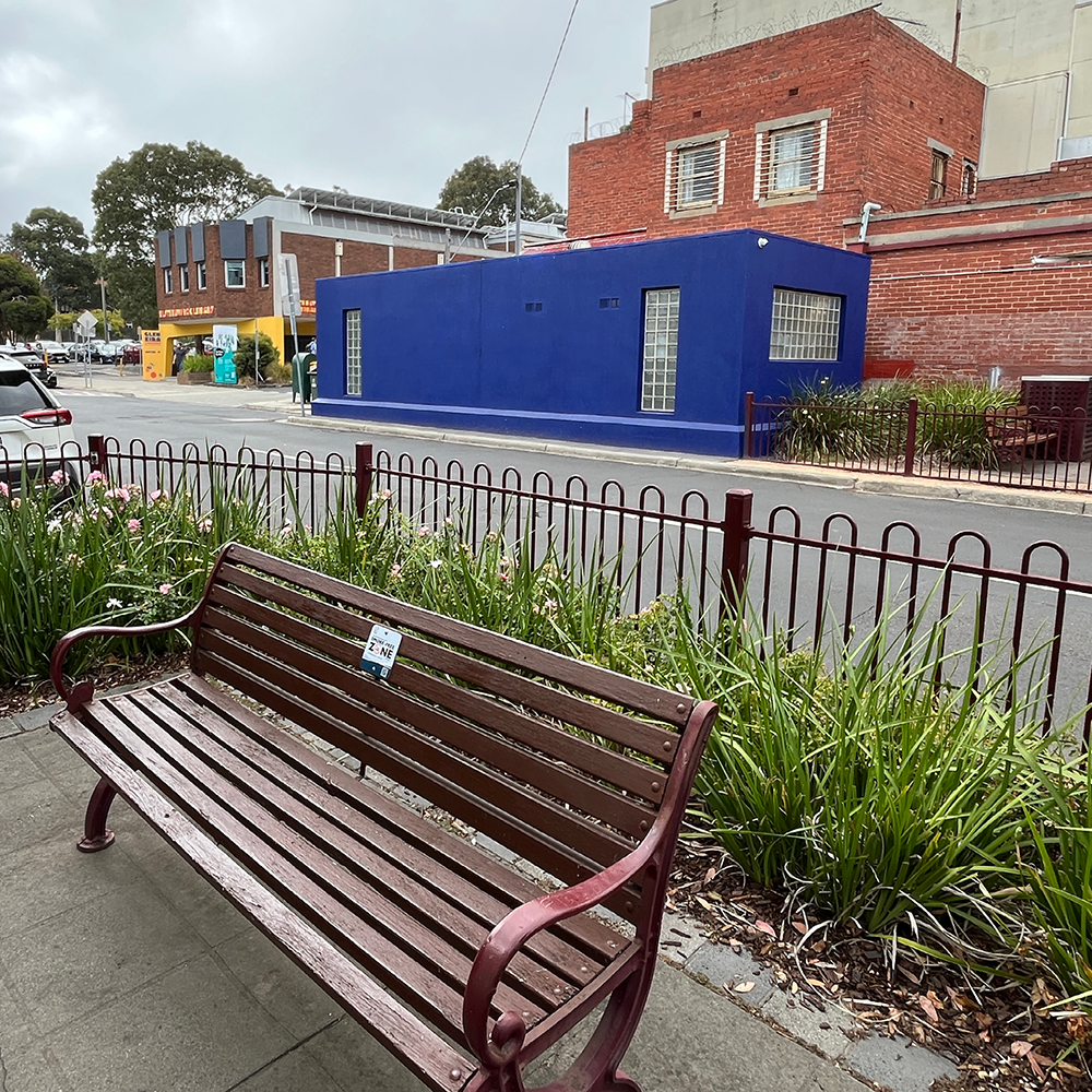 Staniland Grove, seat with some surrounded plantings and a public toilets