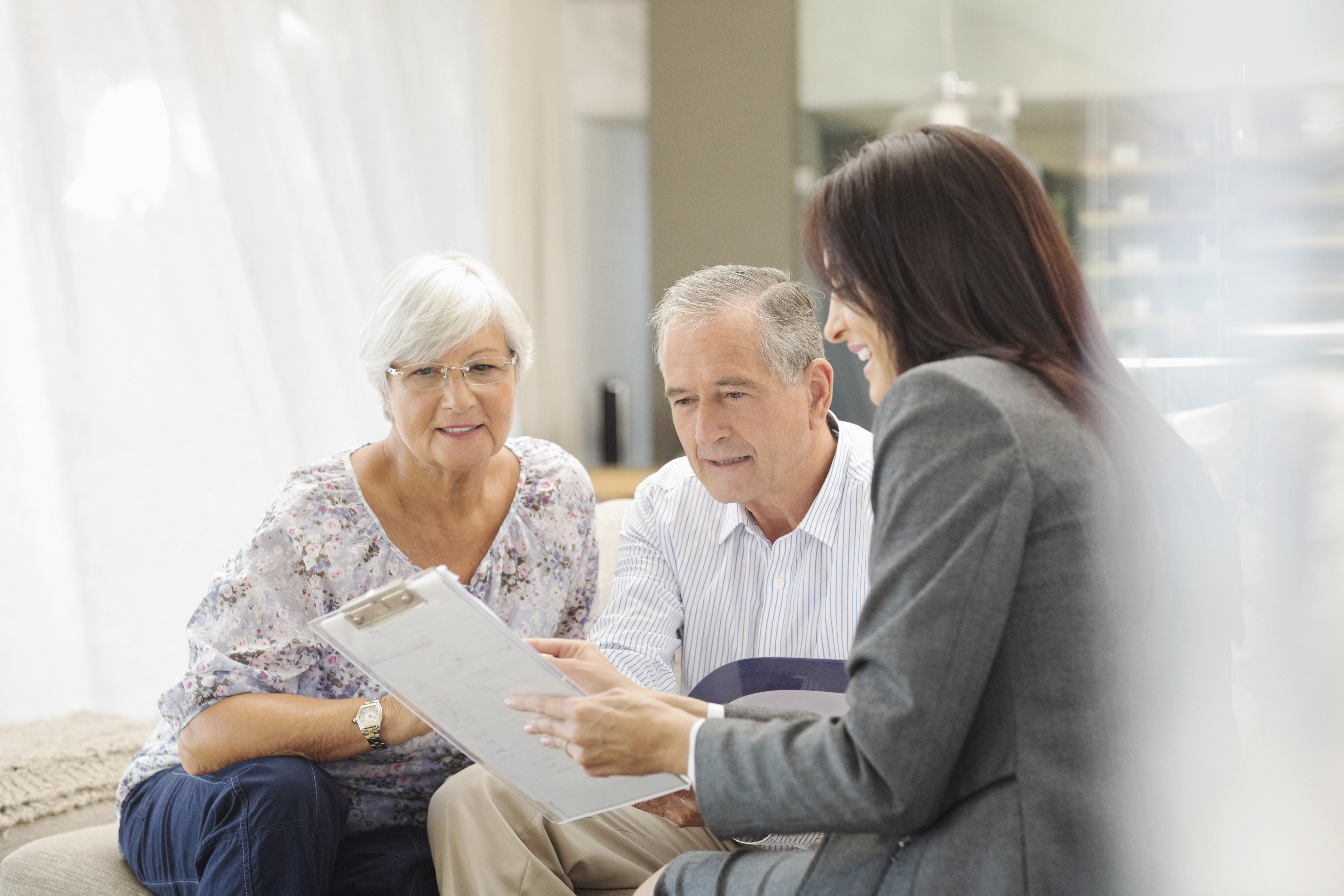 Older community members meet with an adviser to discuss aged care services and support options.