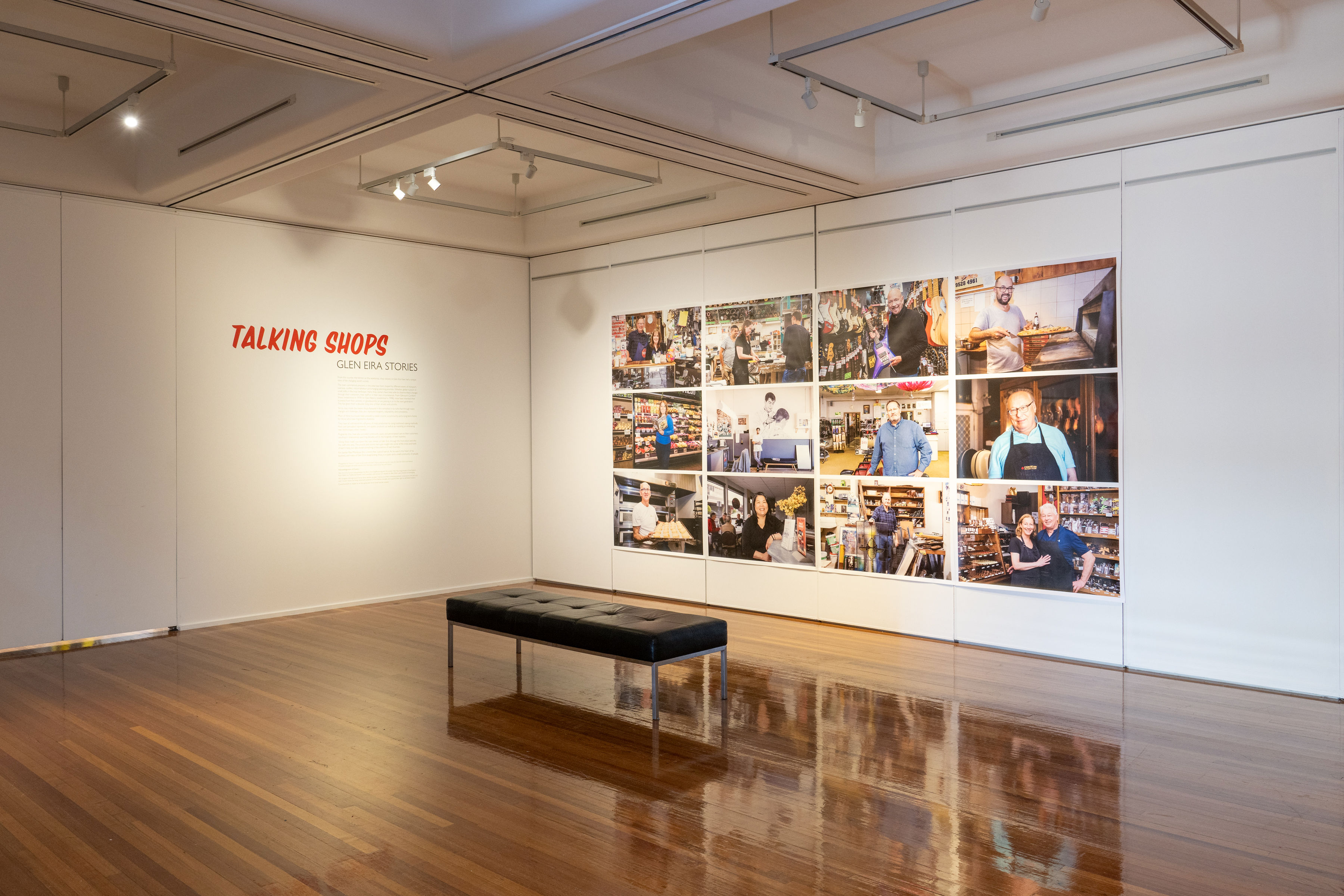 A seat in front of photography collage in the museum