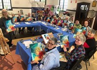 People crafting while doing an art class