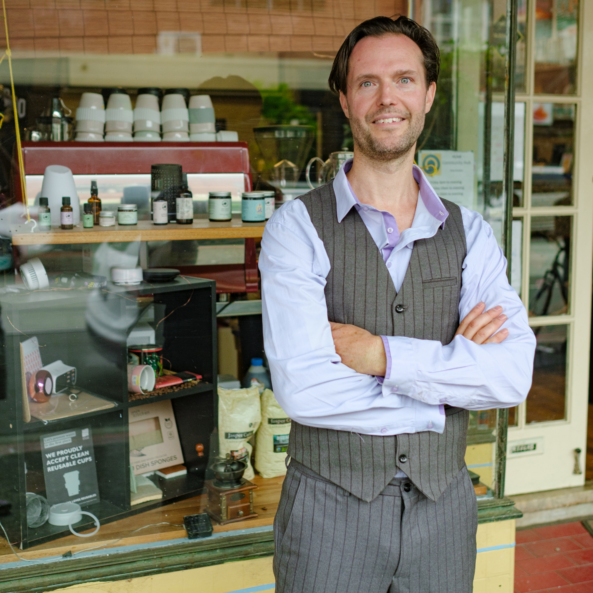 Man in front of shopping front