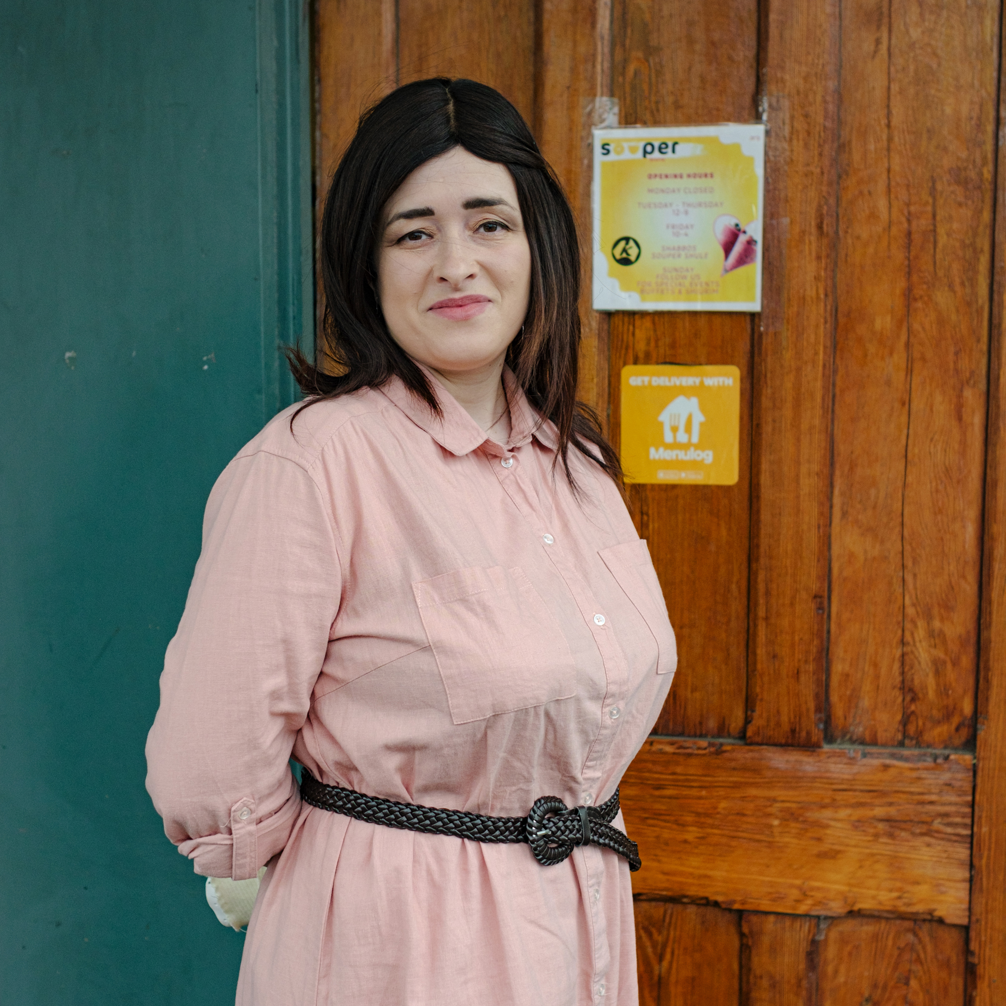 Woman in front of shop