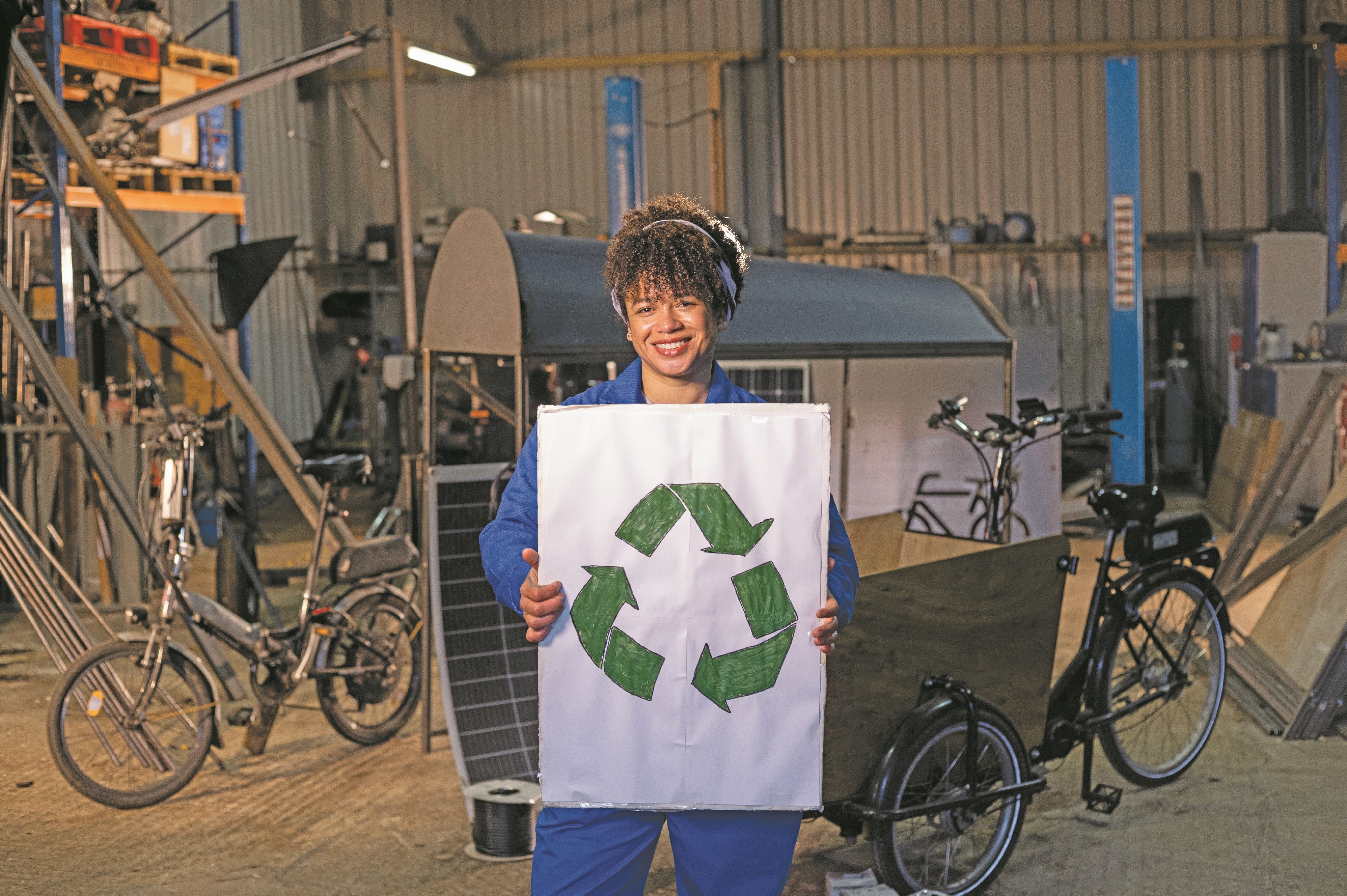 woman holding recycle sign