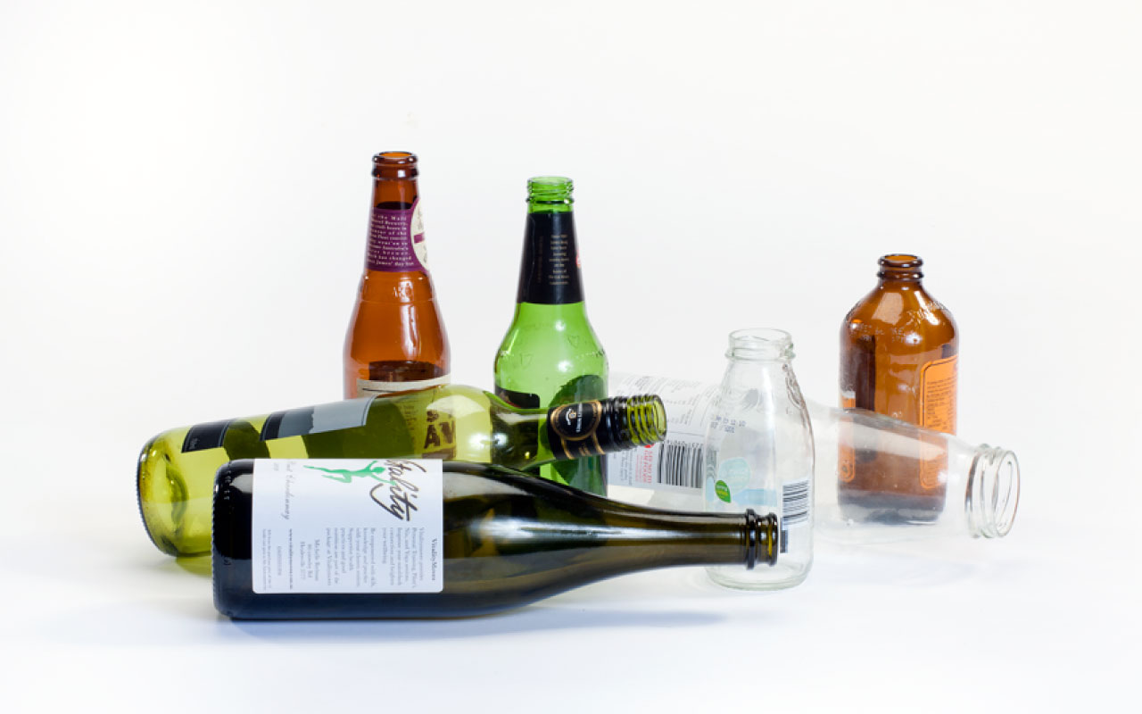 Photo of recyclable glass containers including wine, beer, and soft drink bottles. 