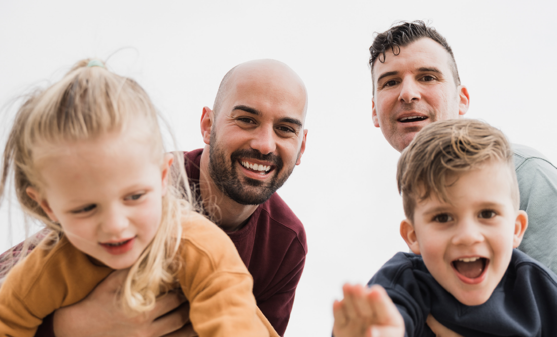 Two dads with a son and daughter