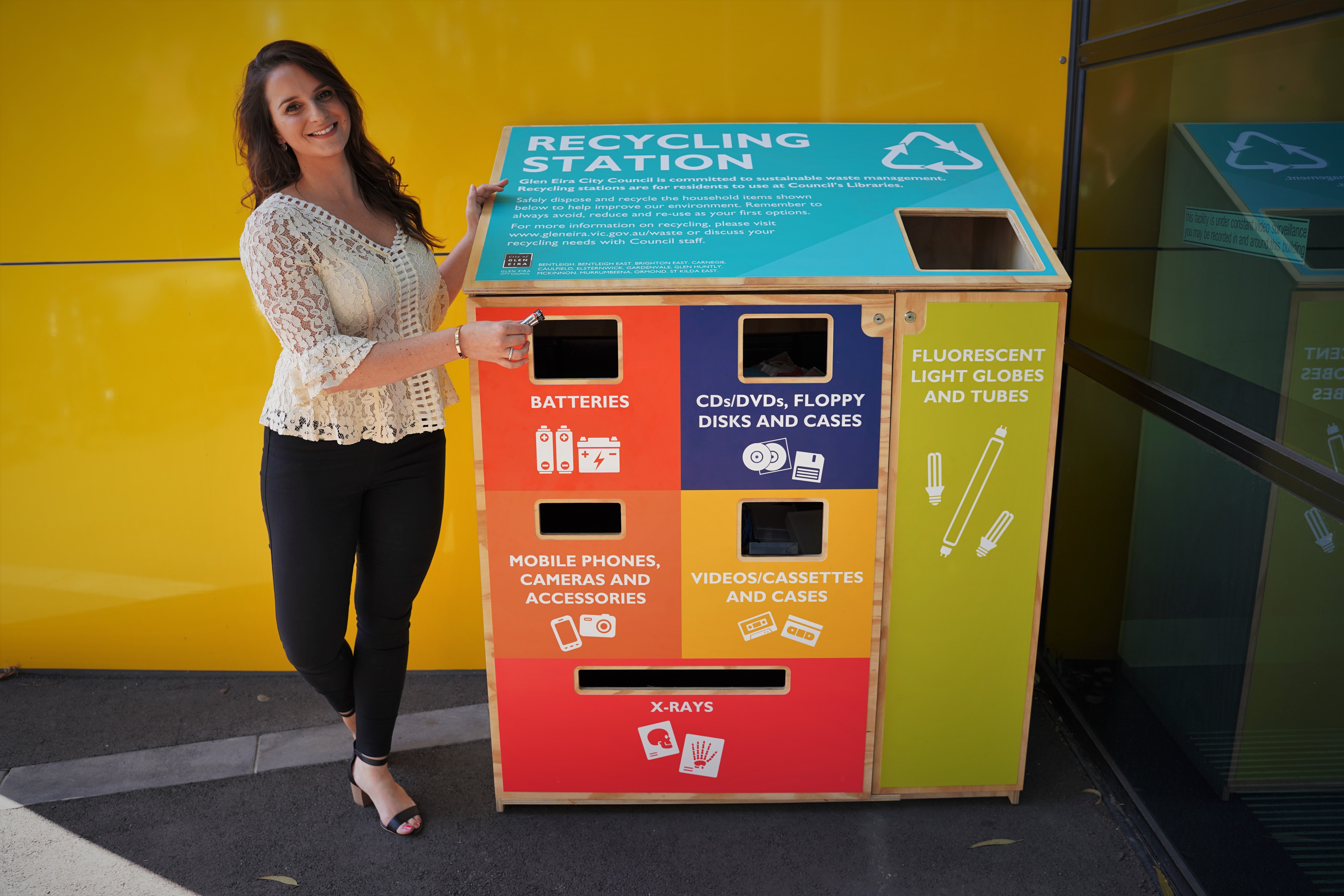 Community member recycles batteries in the E-waste recycling station at a Glen Eira Library