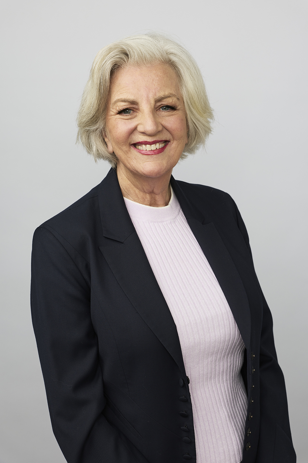 Promotional portrait of speaker Jean Kittson against a plain background.