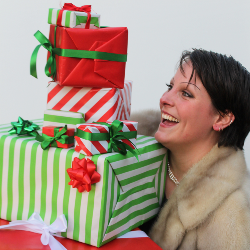 Woman Carrying Festive Gifts