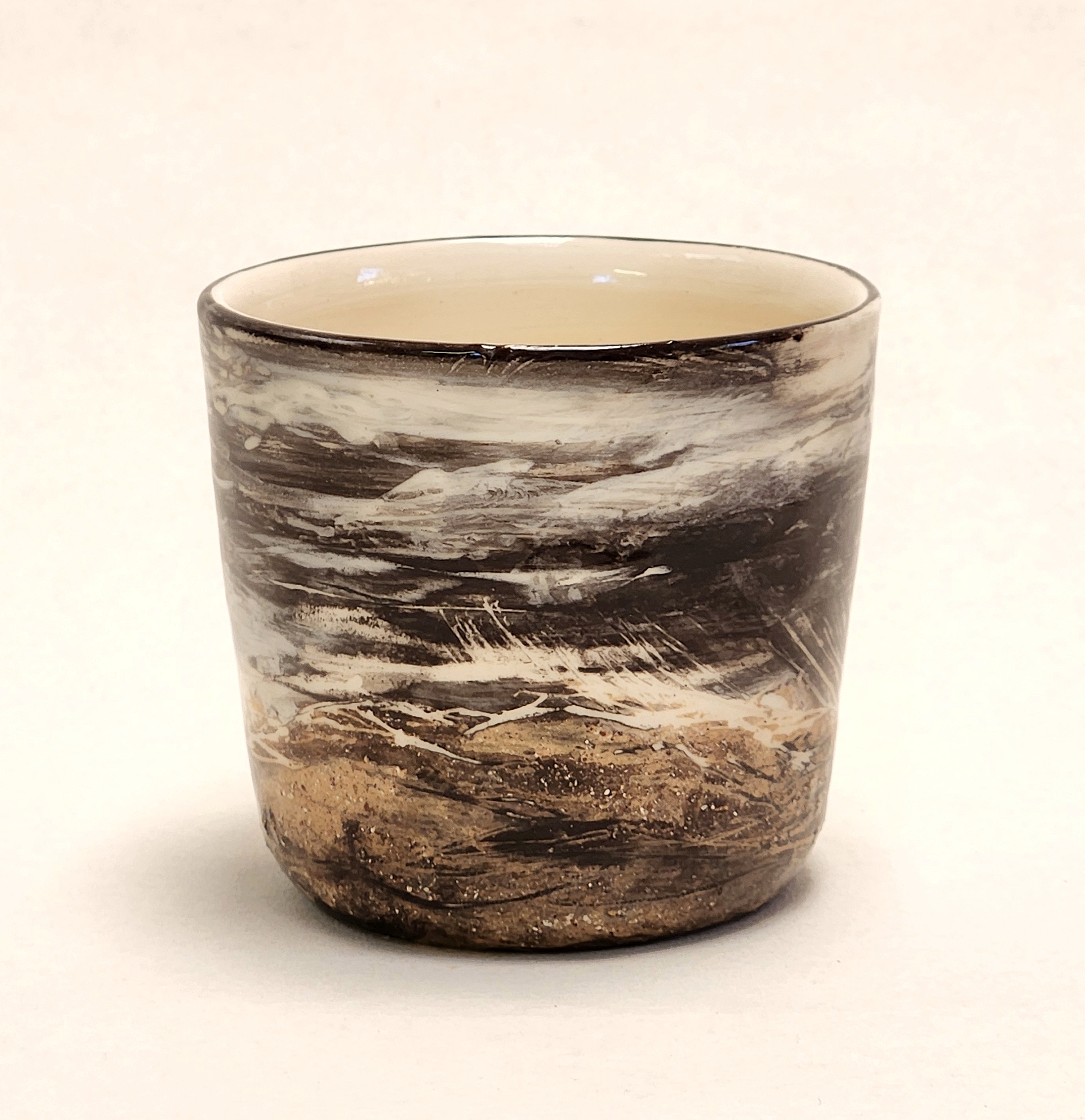 Dominique Dunstan | Storm on a teacup 2025| Slip painting and sgraffito on earthenware | 9 x 8 x 8 cm